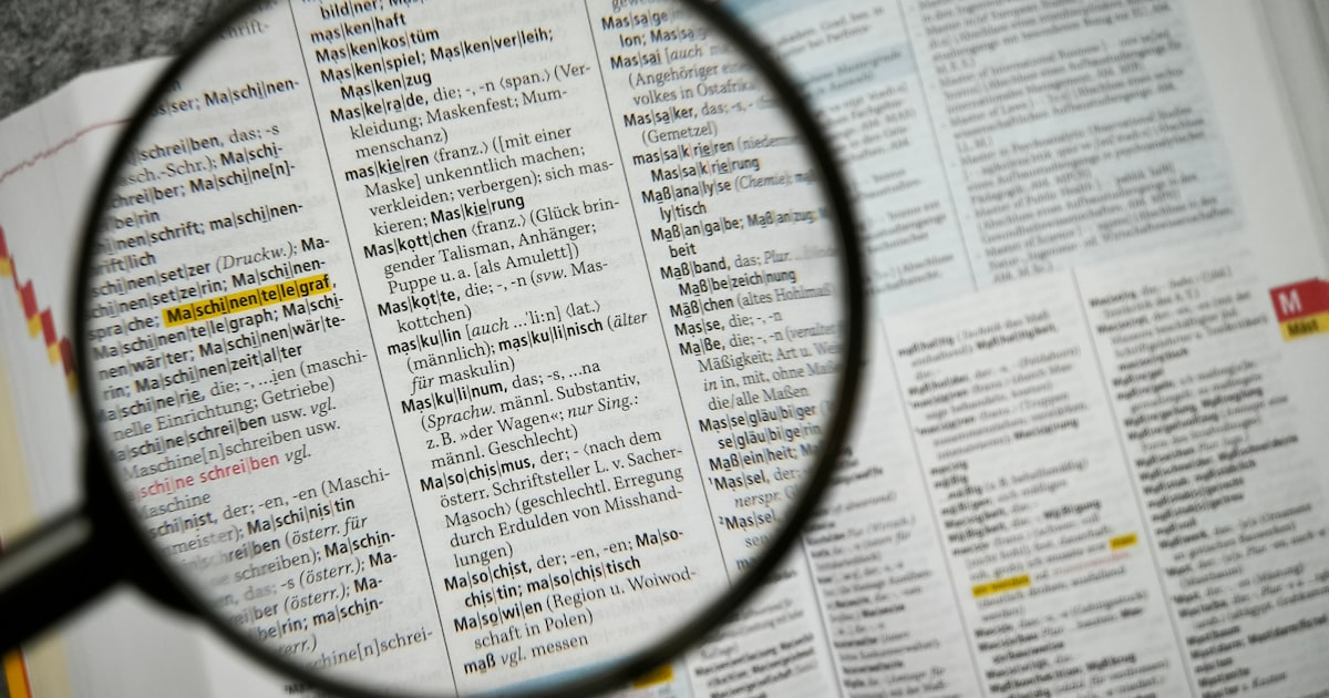A magnifying glass over printed text, suggesting close inspection of a quotation